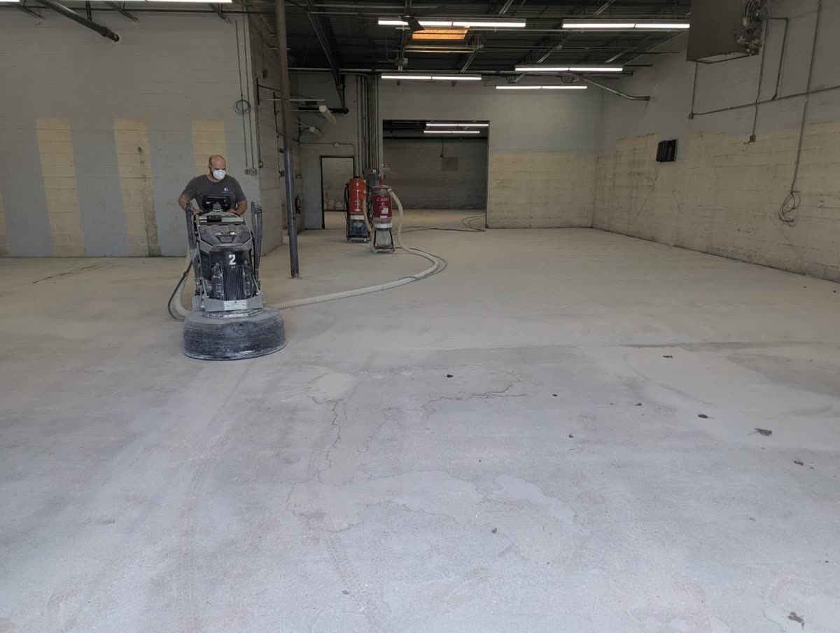 Before: warehouse floor during concrete grinding